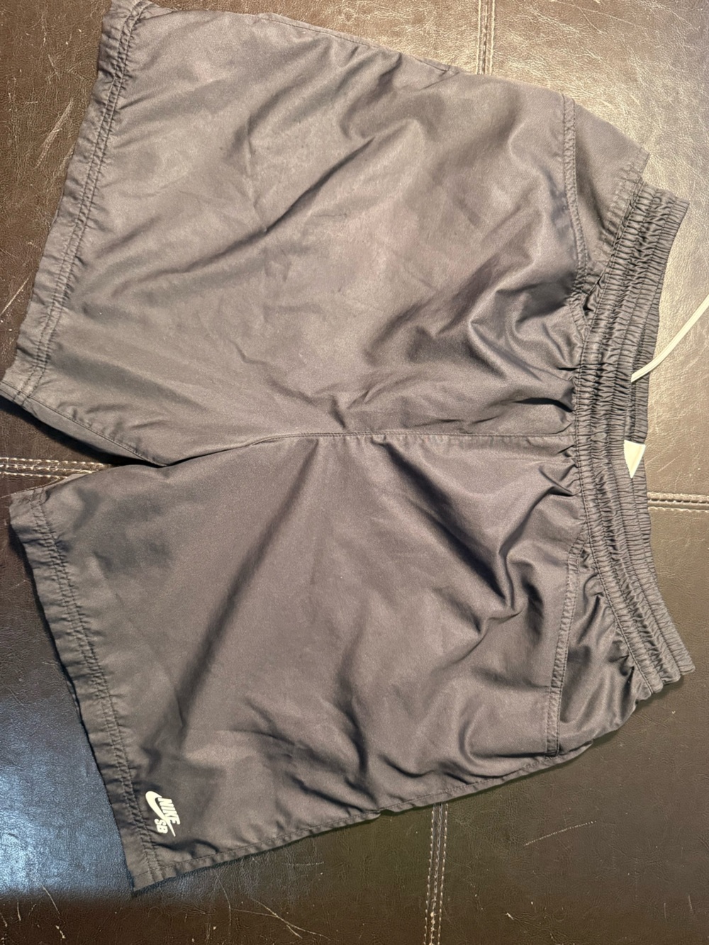 Nike SB Men’s Black Athletic Shorts with White Swoosh.